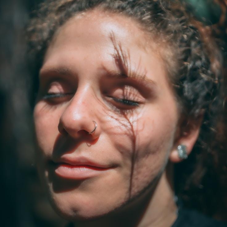 Avery Chen, Lead Design Curator at Ever Light Work Flowhub, reviewing corporate floral arrangements